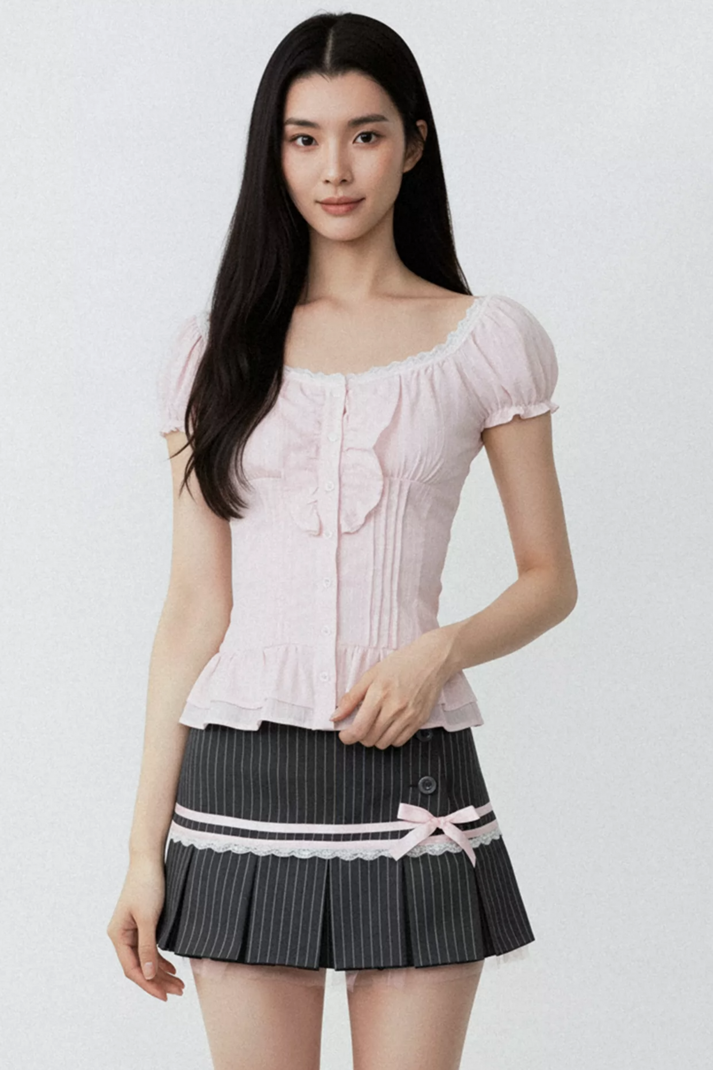 Conjunto de blusa con volantes rosa puro