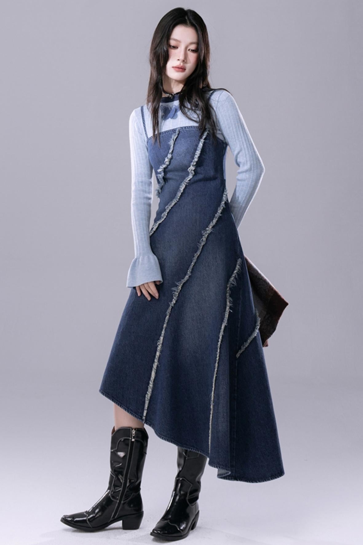 COTRE is a stunningly proportioned aqua blue denim dress with raw edges