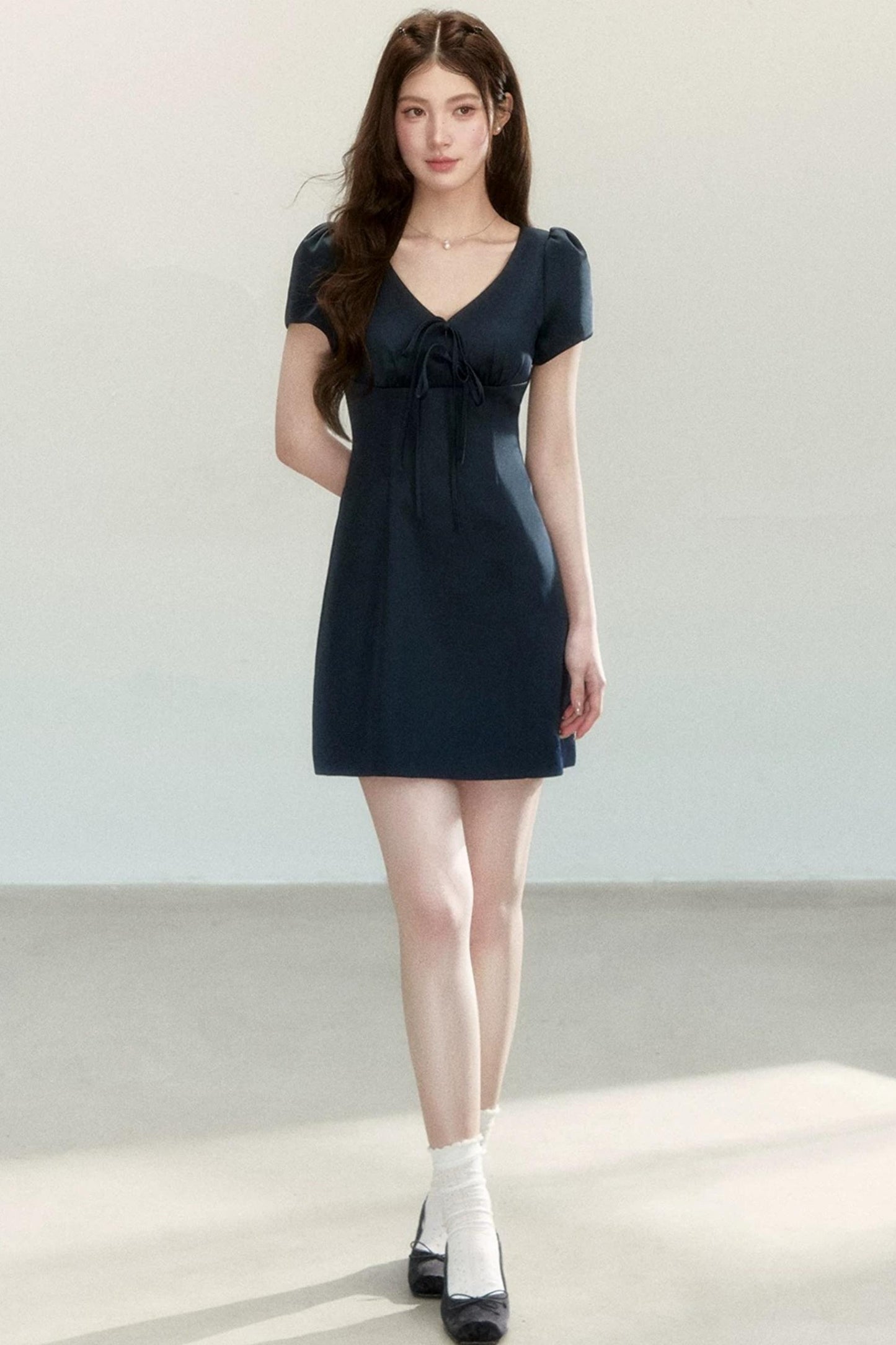 Abito elegante a trapezio con fiocco
