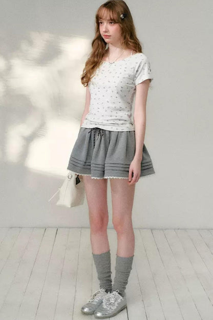 T-shirt con Scollo Asimmetrico e Stampa Floreale