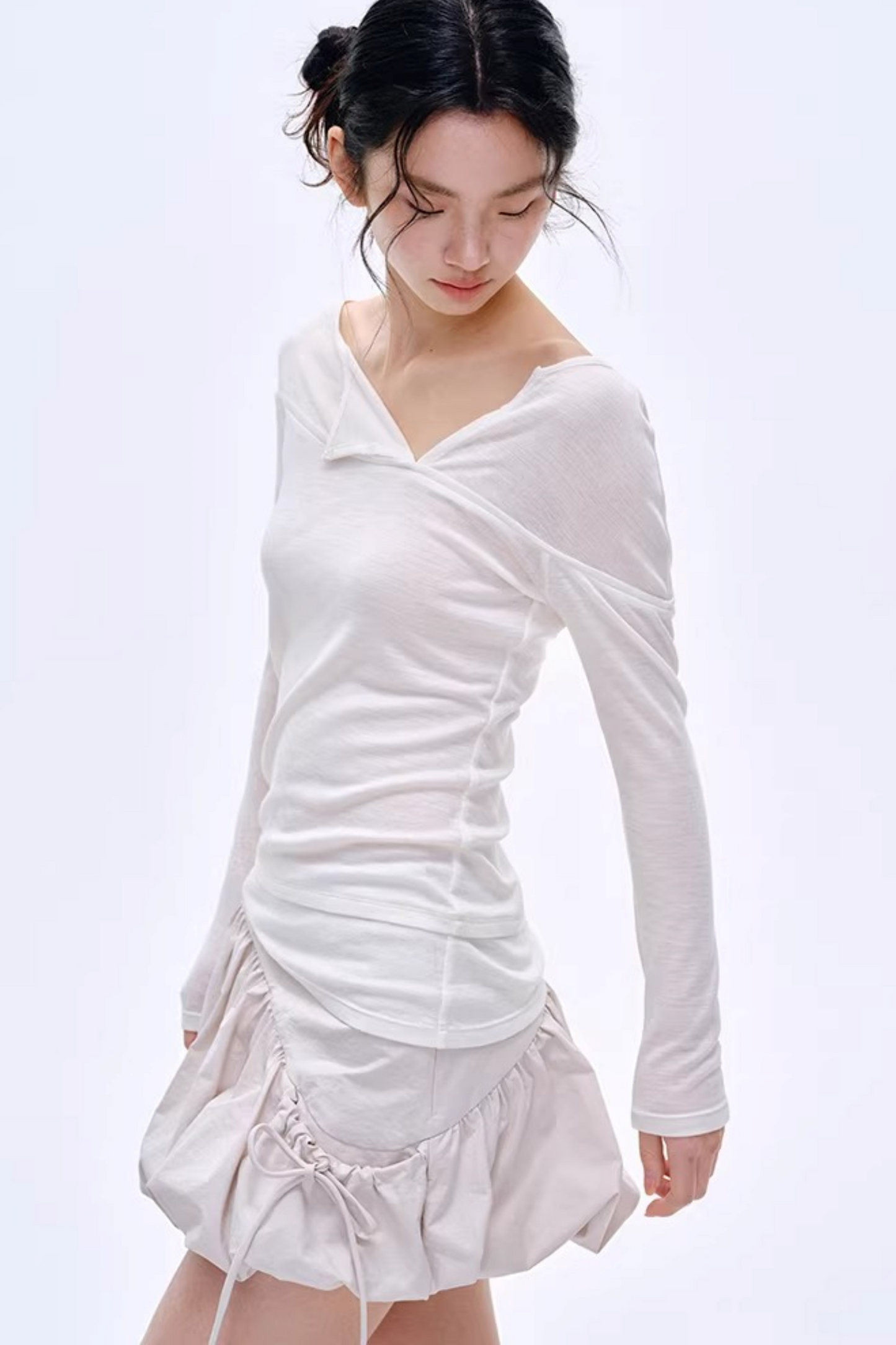 Blusa asimmetrica in misto lana