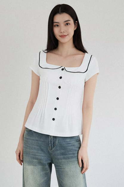Blusa con cuello de muñeca con bloques de color