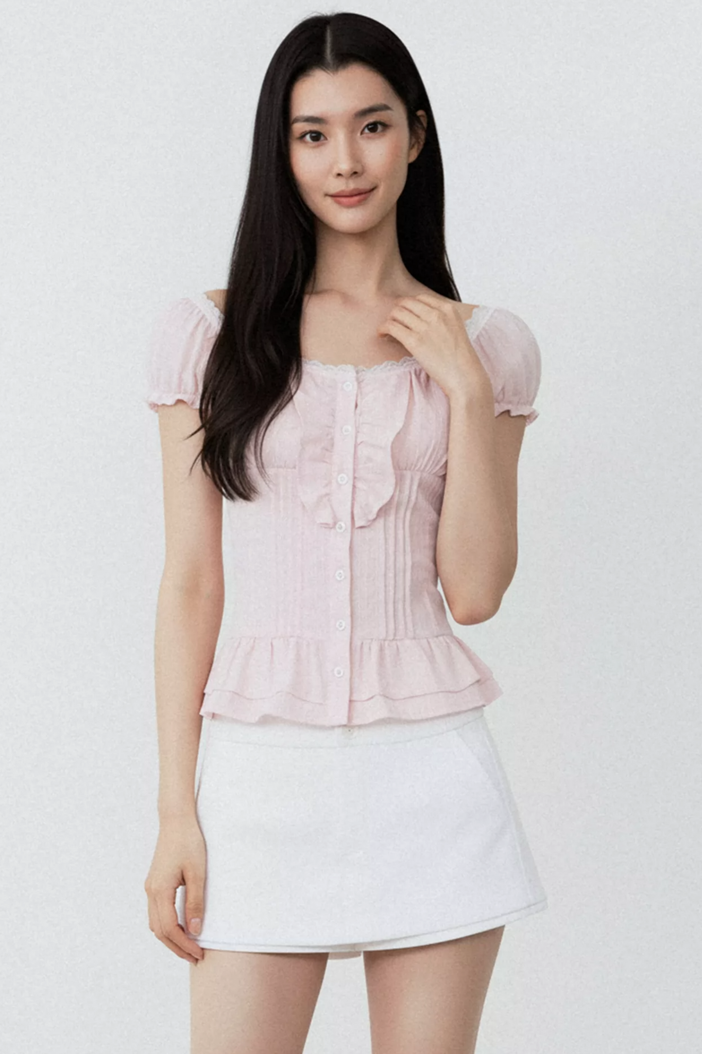 Conjunto de blusa con volantes rosa puro