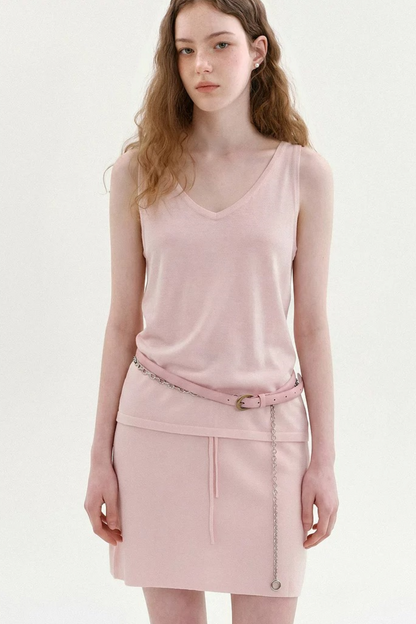 Completo a maglia dalla vestibilità rilassata con cardigan smanicato e gonna