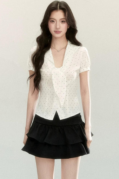 Blusa a pois con collo a fiocco