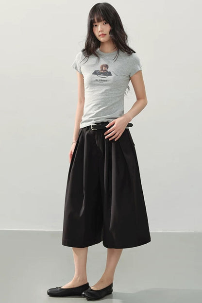 Pantaloni neri drappeggiati a gamba larga