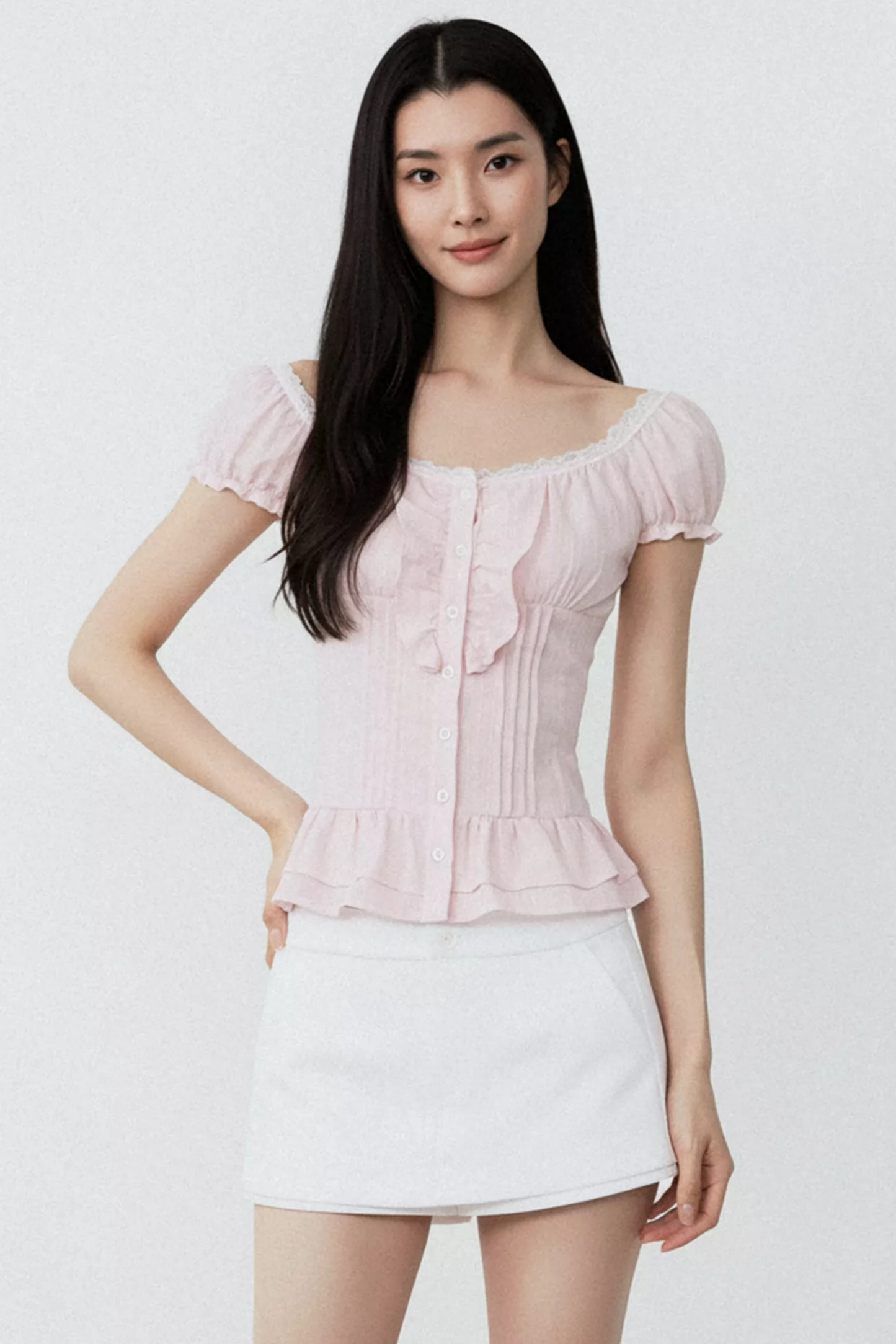 Conjunto de blusa con volantes rosa puro