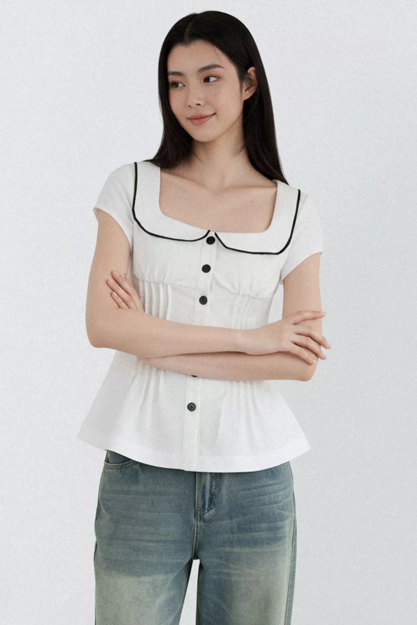 Blusa con cuello de muñeca con bloques de color