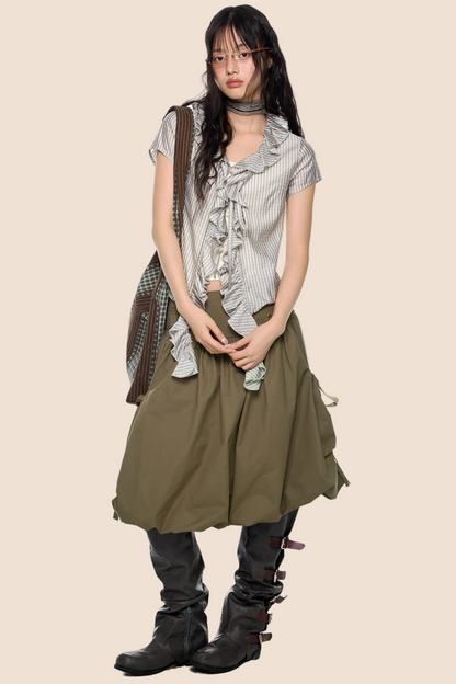 Blusa a quadri con pizzo e scollo a V