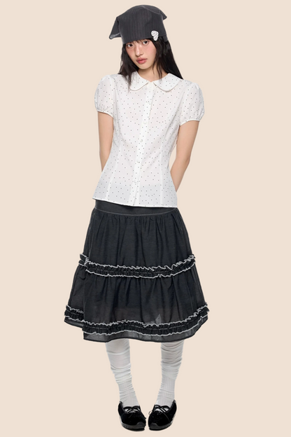 Blusa a pois con maniche a sbuffo