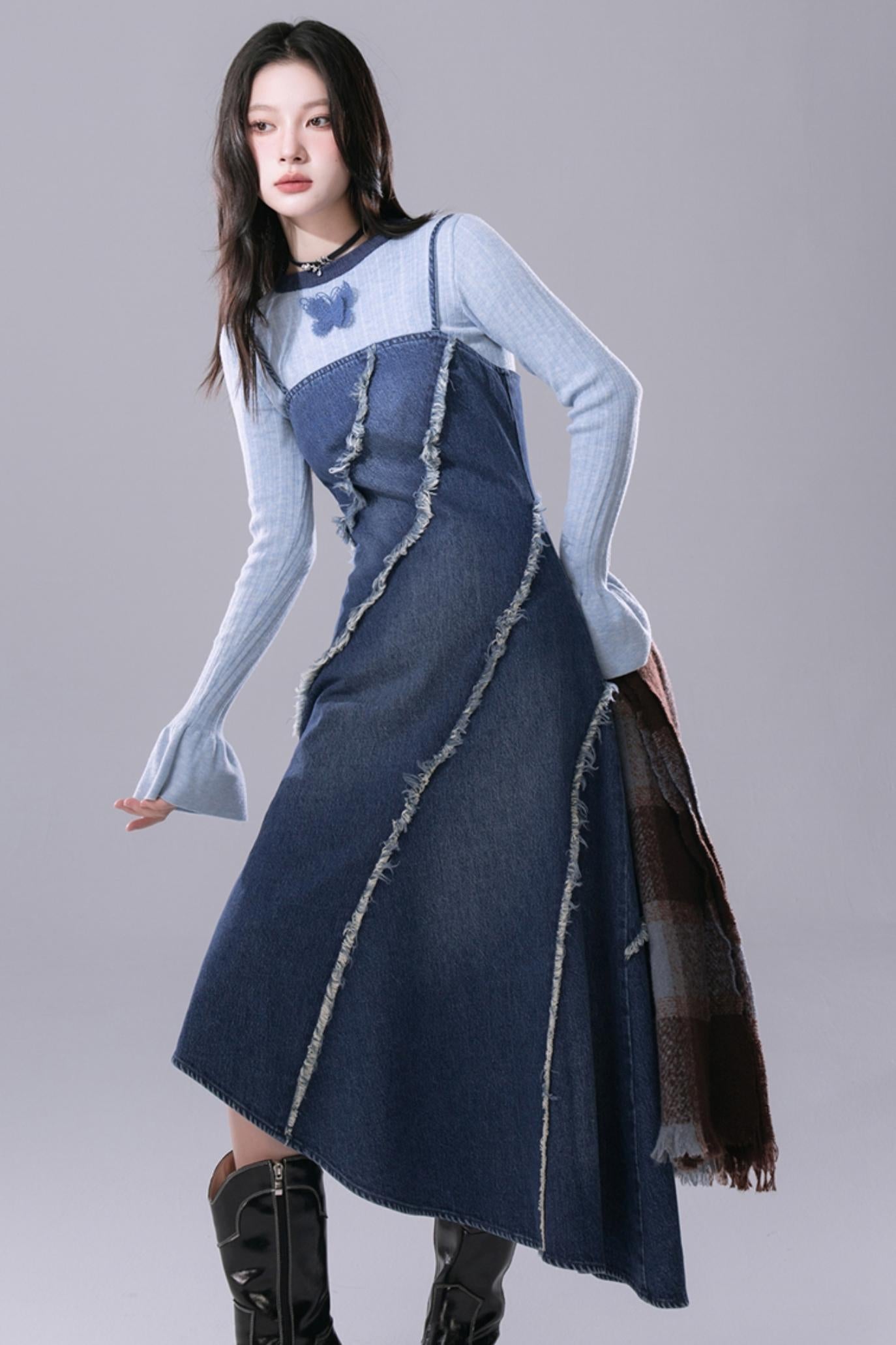 COTRE is a stunningly proportioned aqua blue denim dress with raw edges