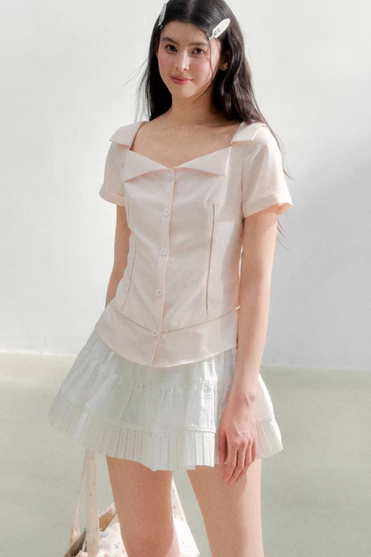 Blusa retrò rosa con risvolto