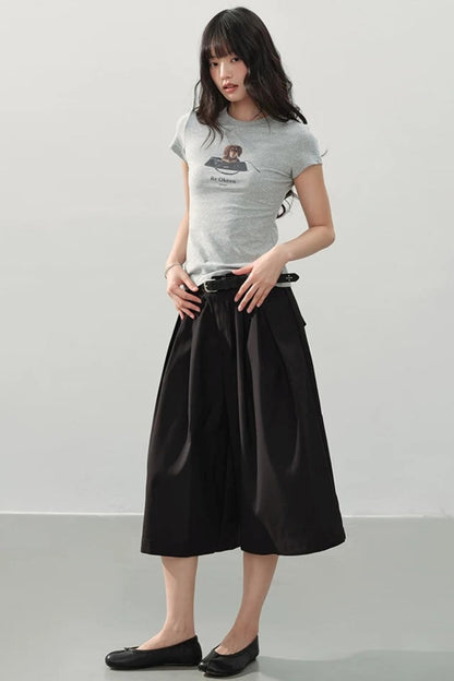 Pantaloni neri drappeggiati a gamba larga