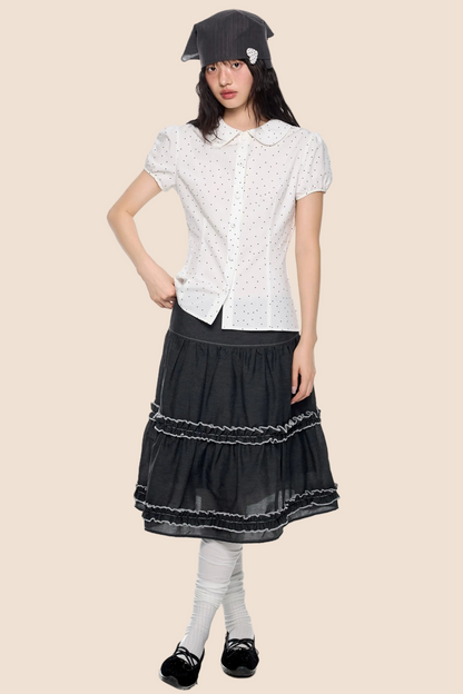Blusa a pois con maniche a sbuffo