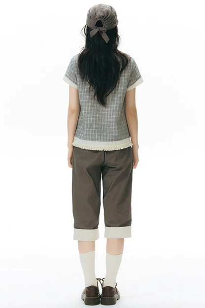 Camicia a quadri con volant e scollo a V