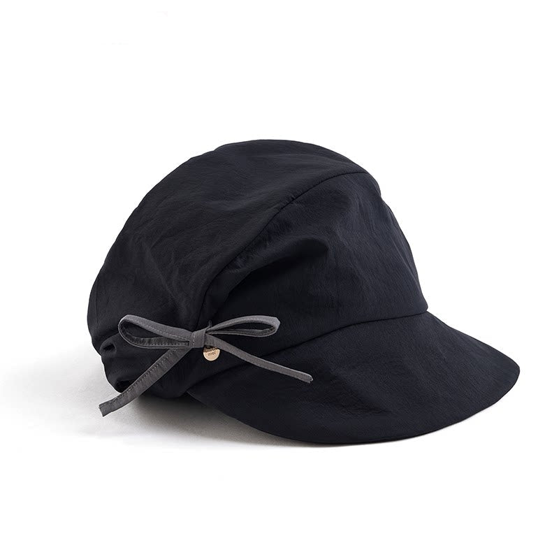 Elegante unregelmäßige Schirmmütze mit Falten