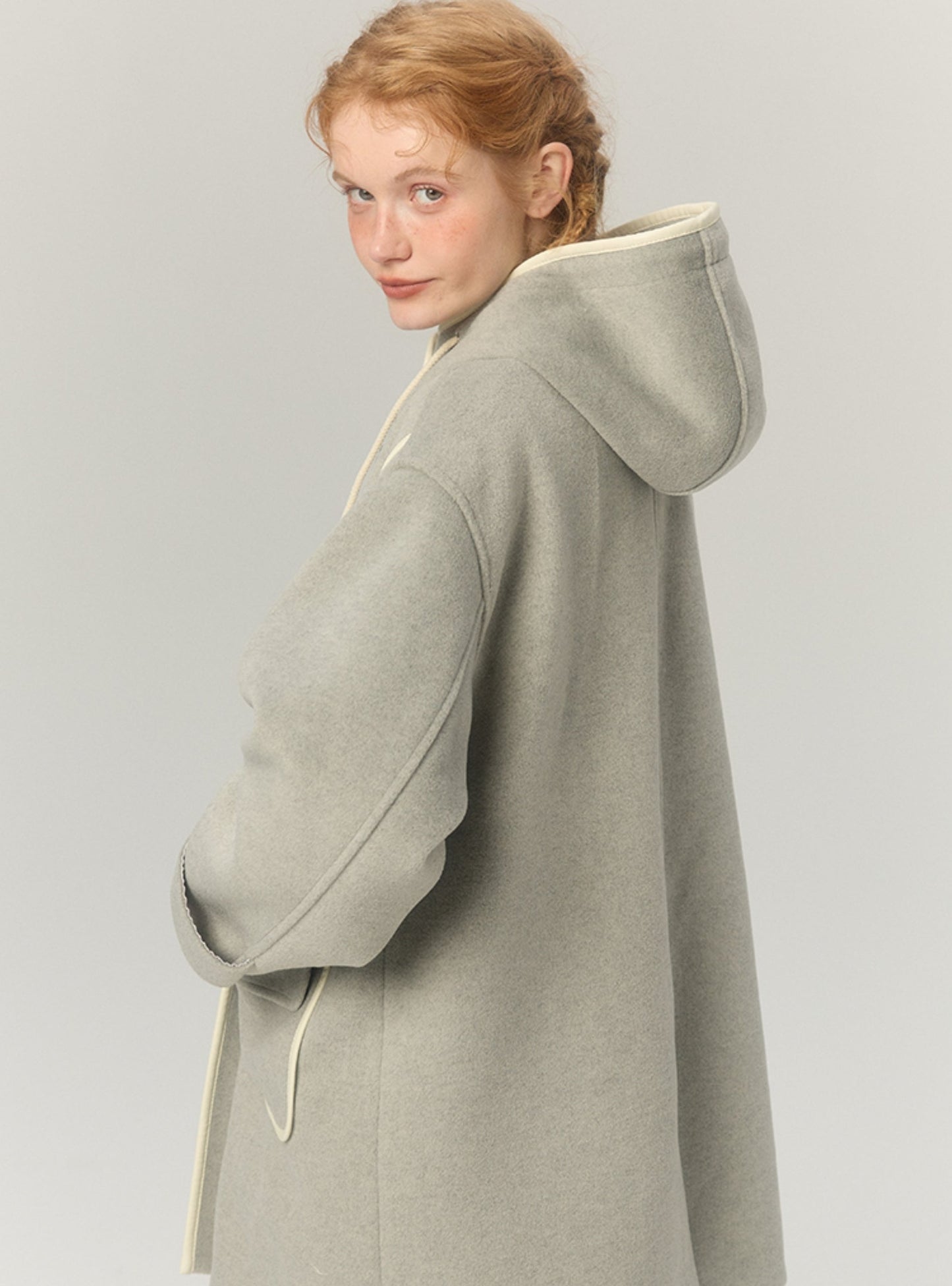 Woolen midlength hooded tweed coat