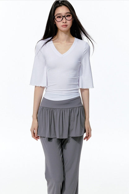 Completo rosa con top a maniche a campana e pantaloni da yoga