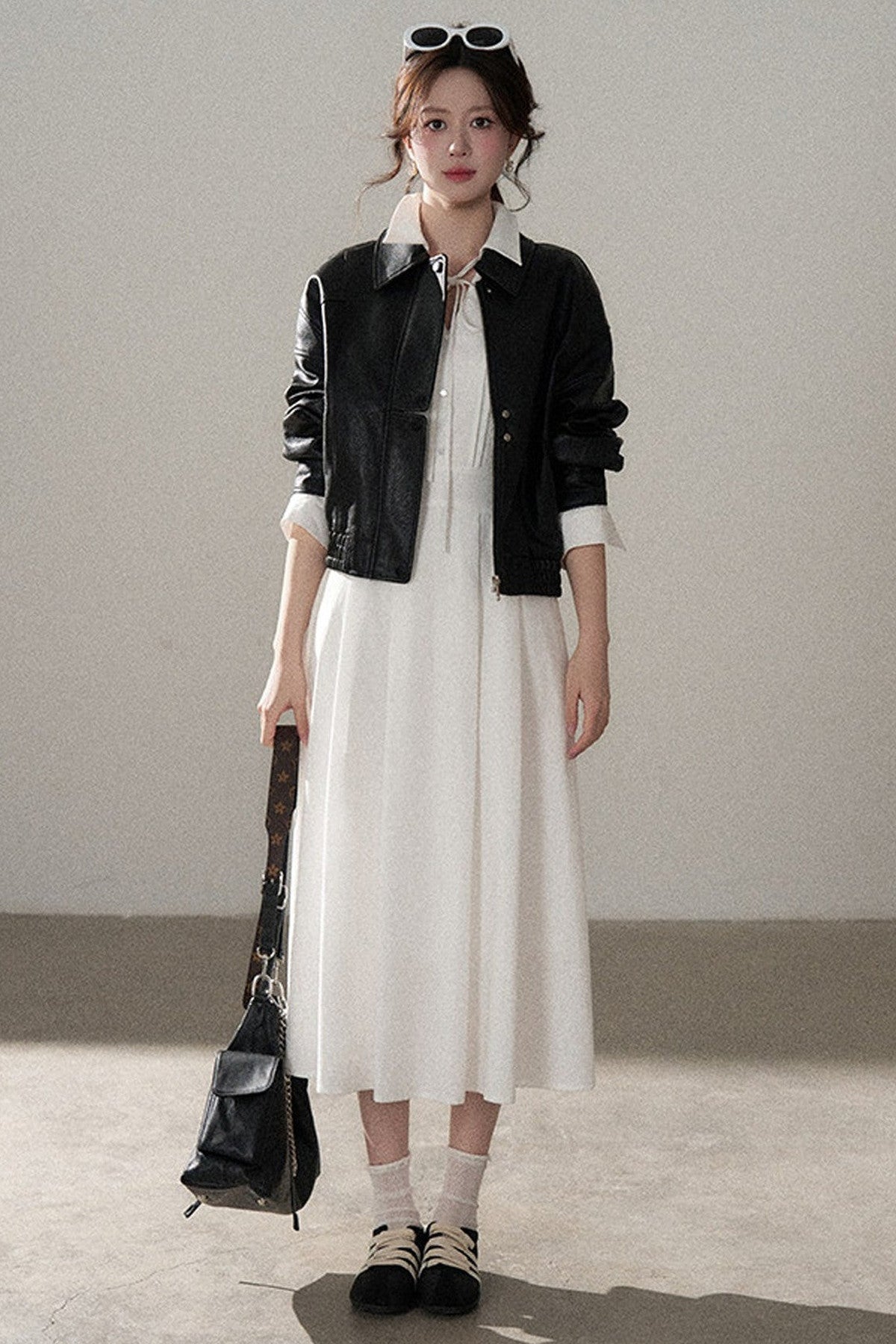 Giacca corta in pelle PU con revers