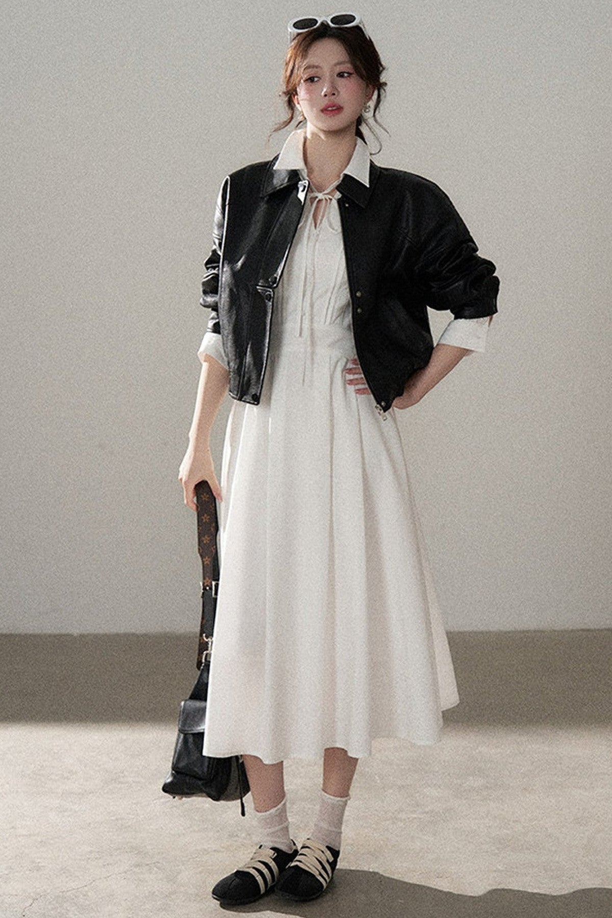 Giacca corta in pelle PU con revers