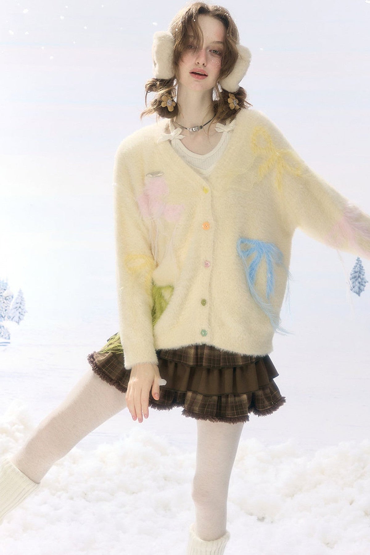 Cardigan in maglia soffice color albicocca con fiocco