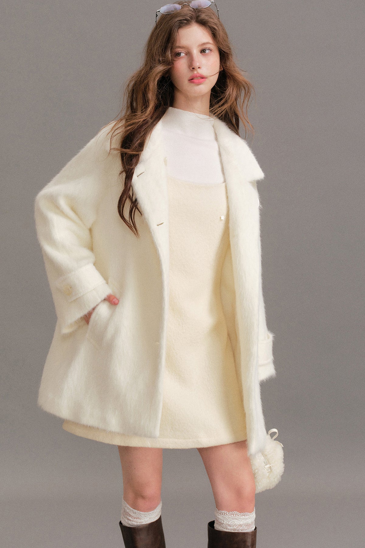 Manteau mi-long en laine imitation vison à épaules tombantes