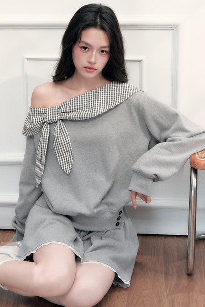 Ensemble sweatshirt épaules dénudées et jupe patchwork à carreaux