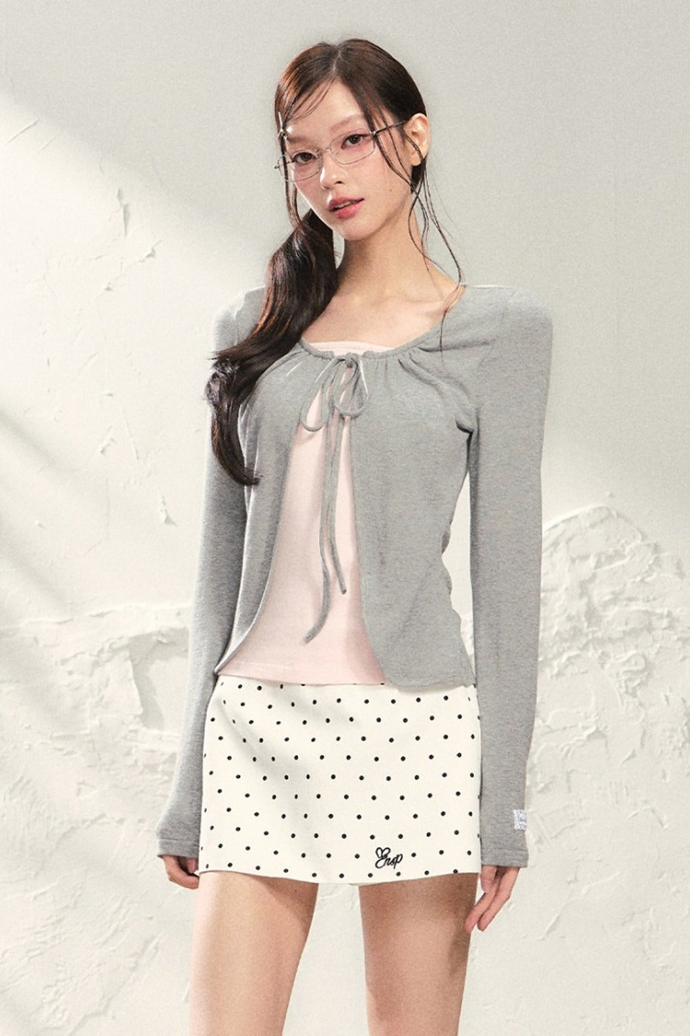 Conjunto de top de punto de manga larga y falda