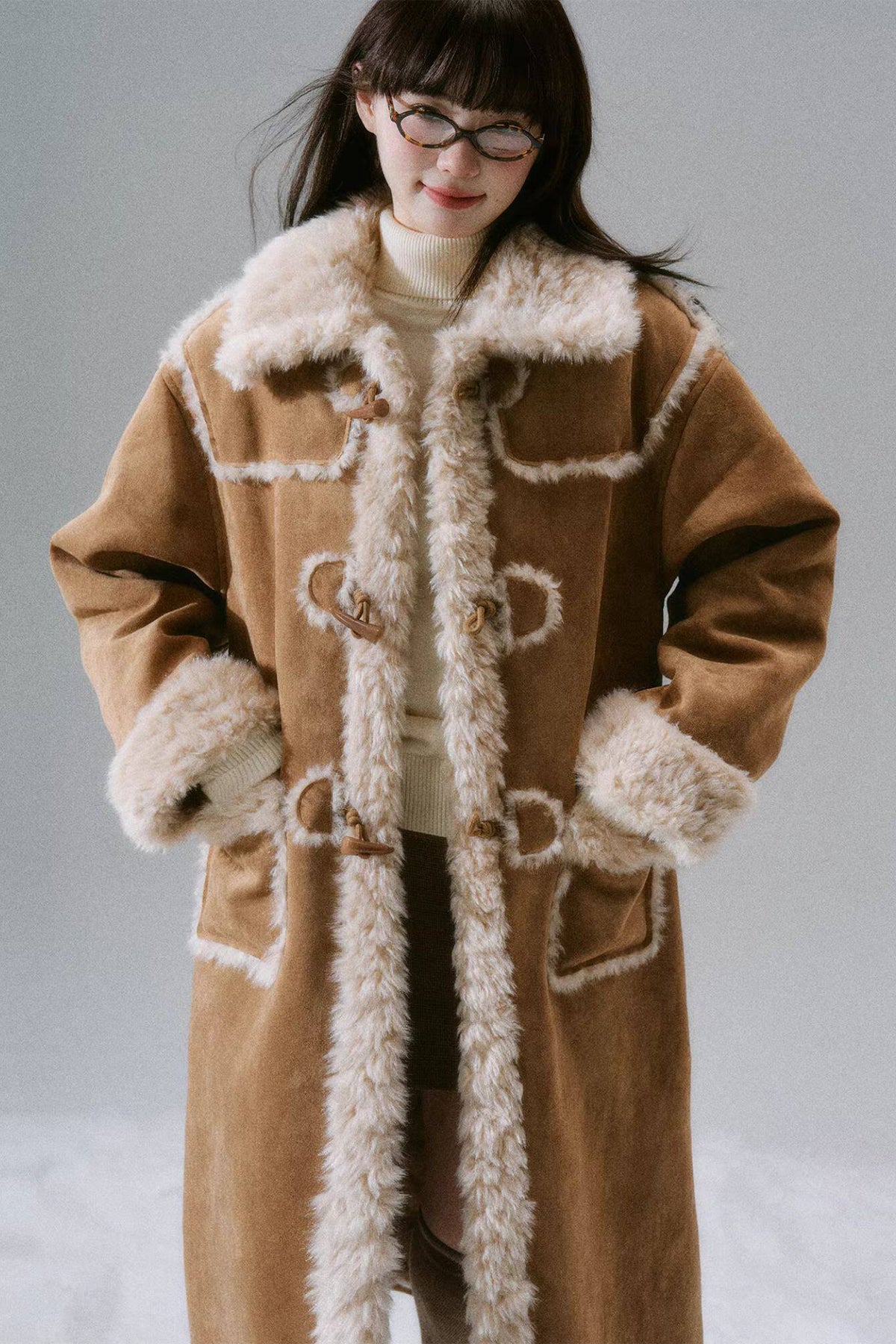 Manteau long à boutons en corne