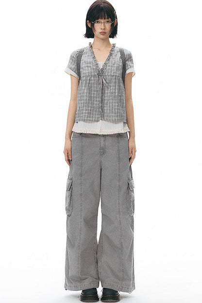 Camicia a quadri con volant e scollo a V