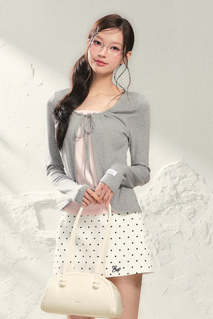 Conjunto de top de punto de manga larga y falda