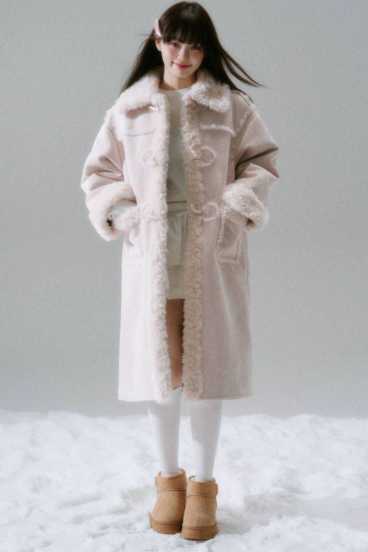 Manteau long à boutons en corne