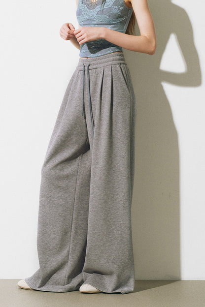 Completo giacca, gilet con bordi in pizzo e pantaloni ampi a maglia