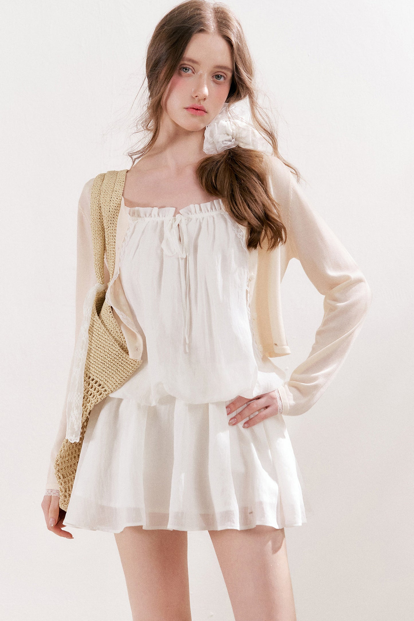 Cardigan in maglia trasparente 100% Lyocell con bordo in pizzo