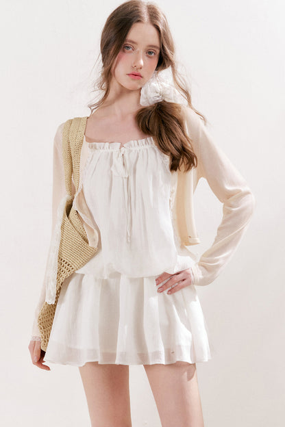 Cardigan in maglia trasparente 100% Lyocell con bordo in pizzo