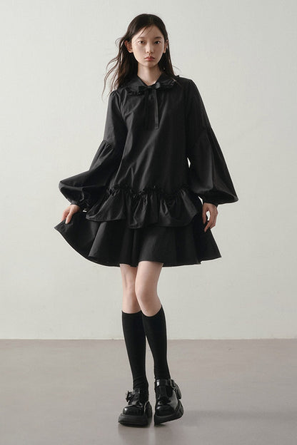 Robe noire asymétrique à volants et manches lanternes