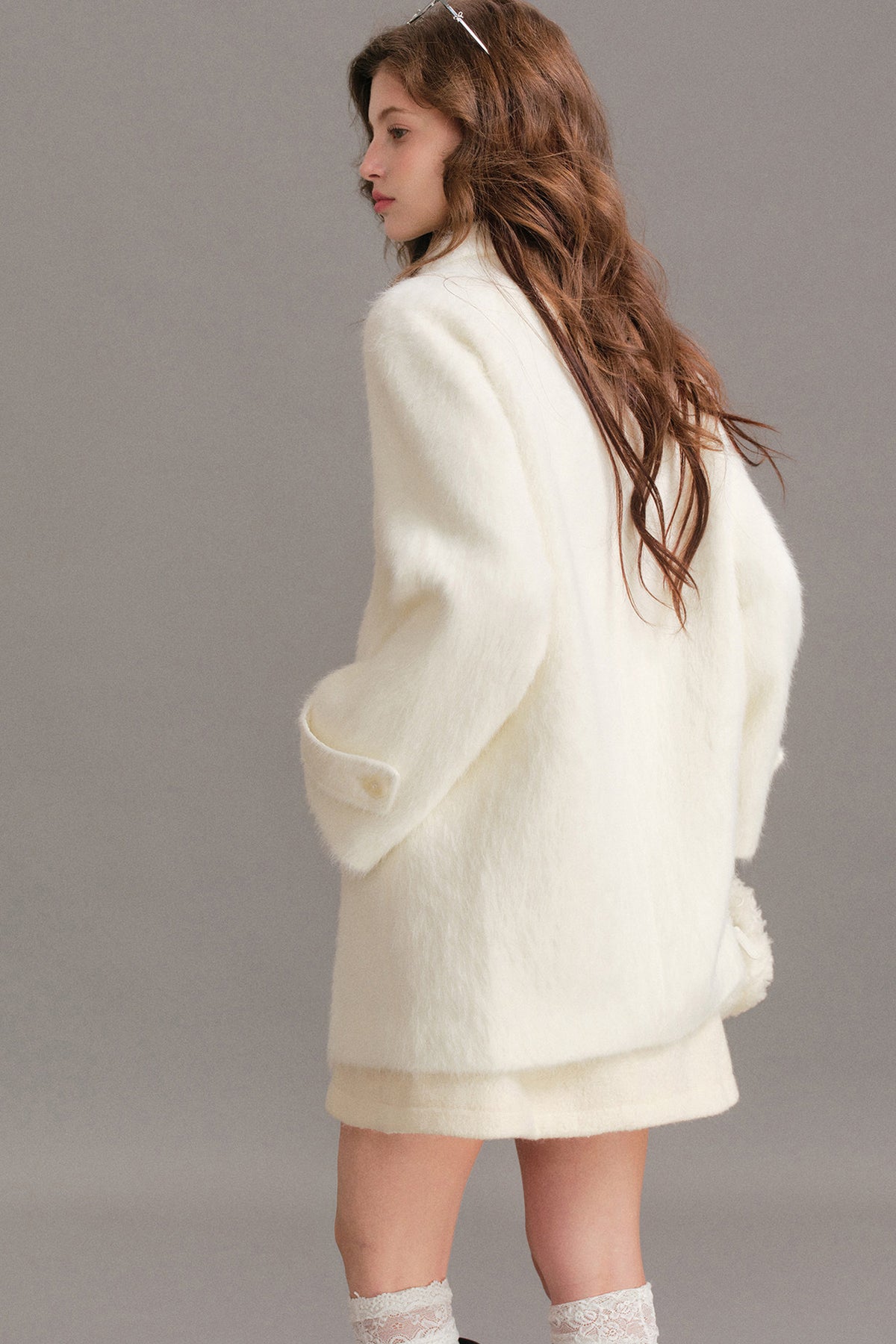 Manteau mi-long en laine imitation vison à épaules tombantes