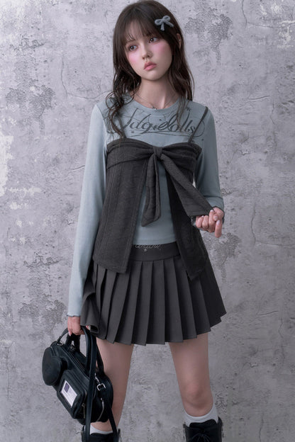 Blusa grigio-azzurra a maniche lunghe con fiocco e effetto a strati