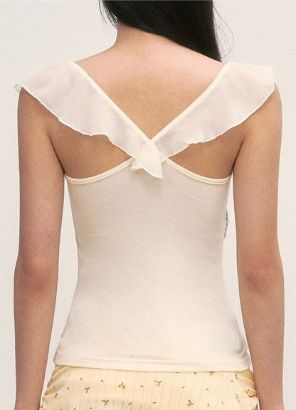Top con cuello drapeado y mangas con volantes