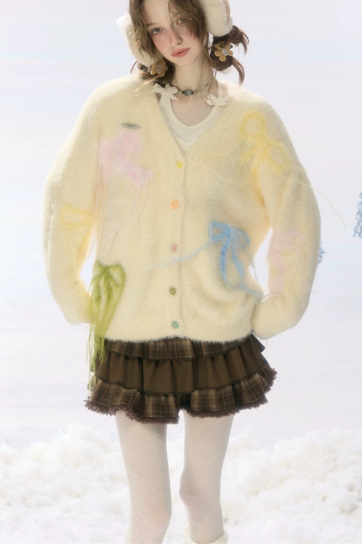 Cardigan in maglia soffice color albicocca con fiocco