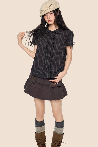 Camicia a righe con fiocco plissettato
