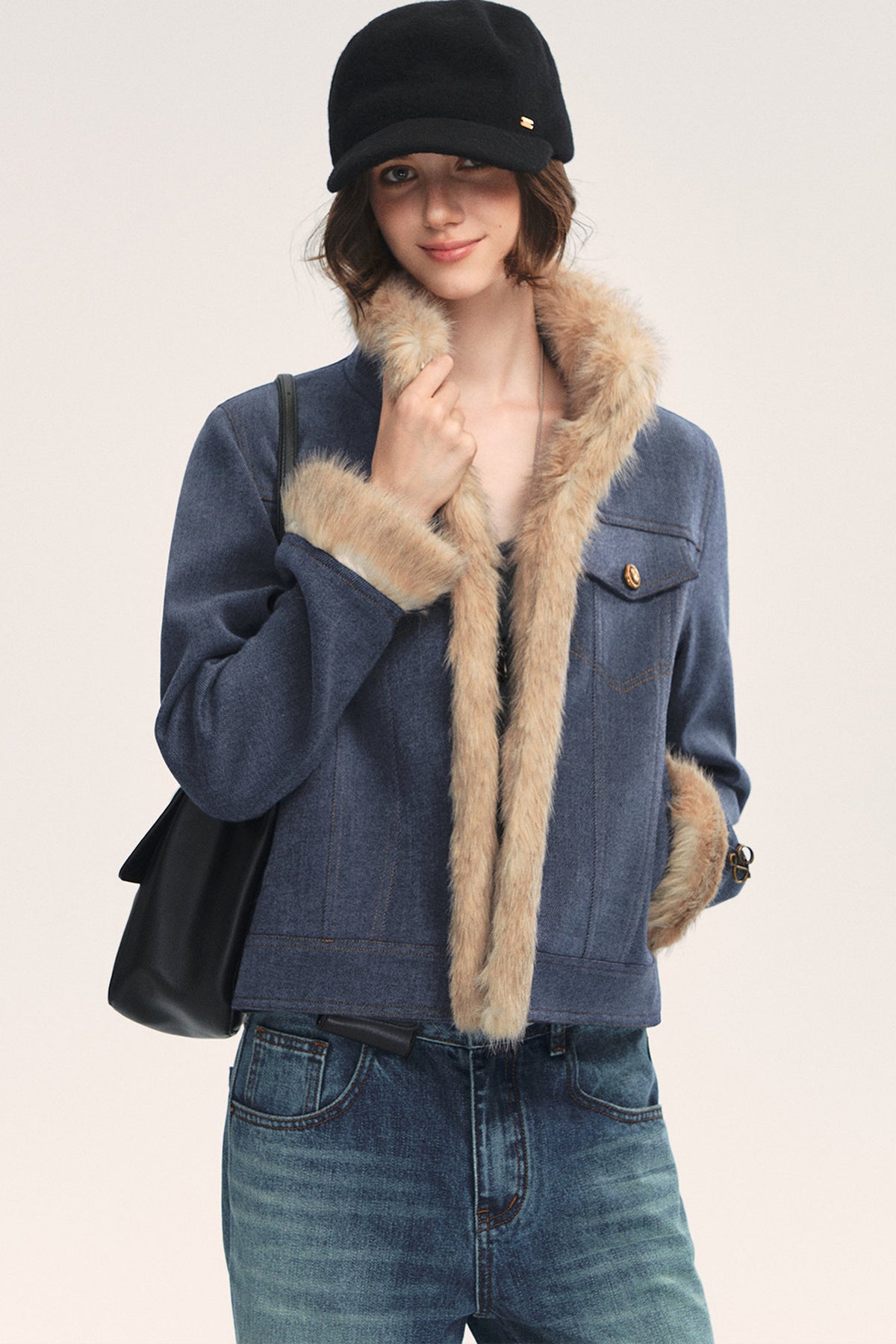Jeansblaue Patchwork-Jacke mit Fellrevers