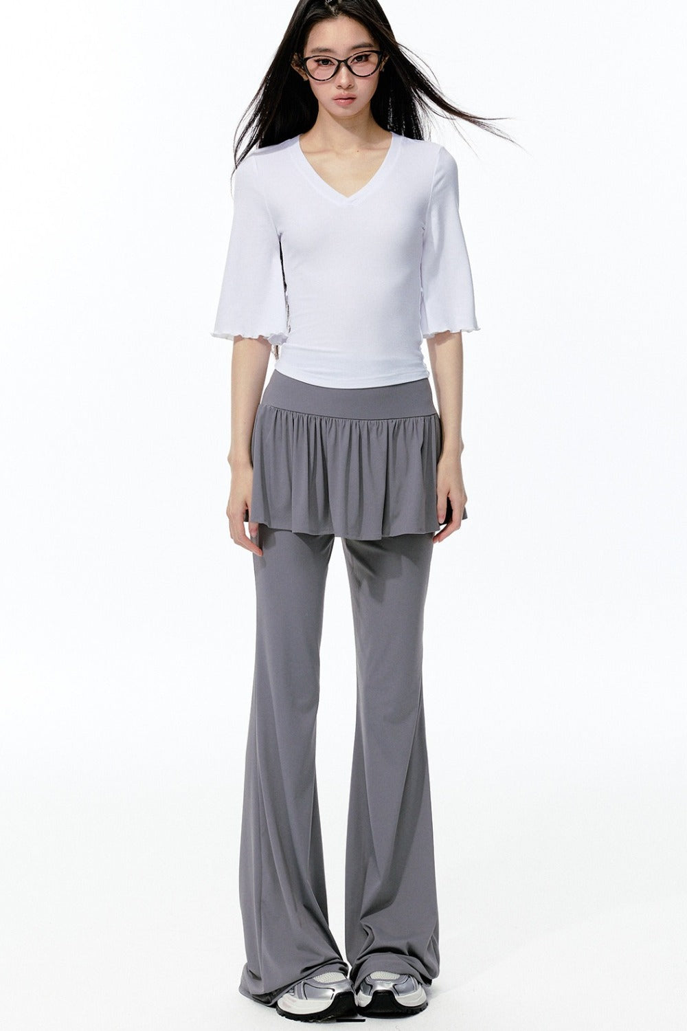 Completo rosa con top a maniche a campana e pantaloni da yoga