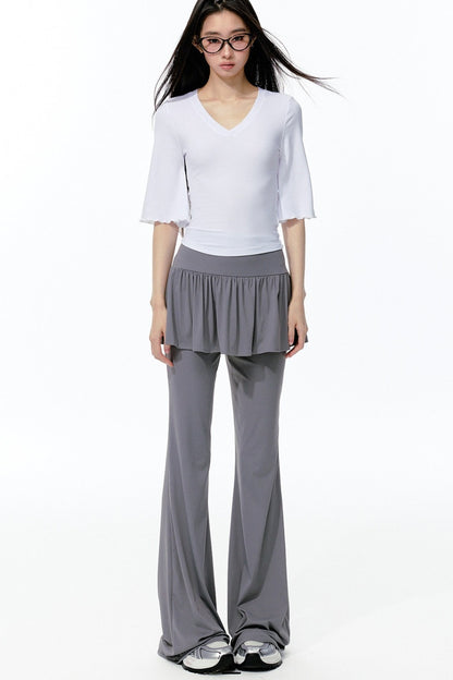 Completo rosa con top a maniche a campana e pantaloni da yoga