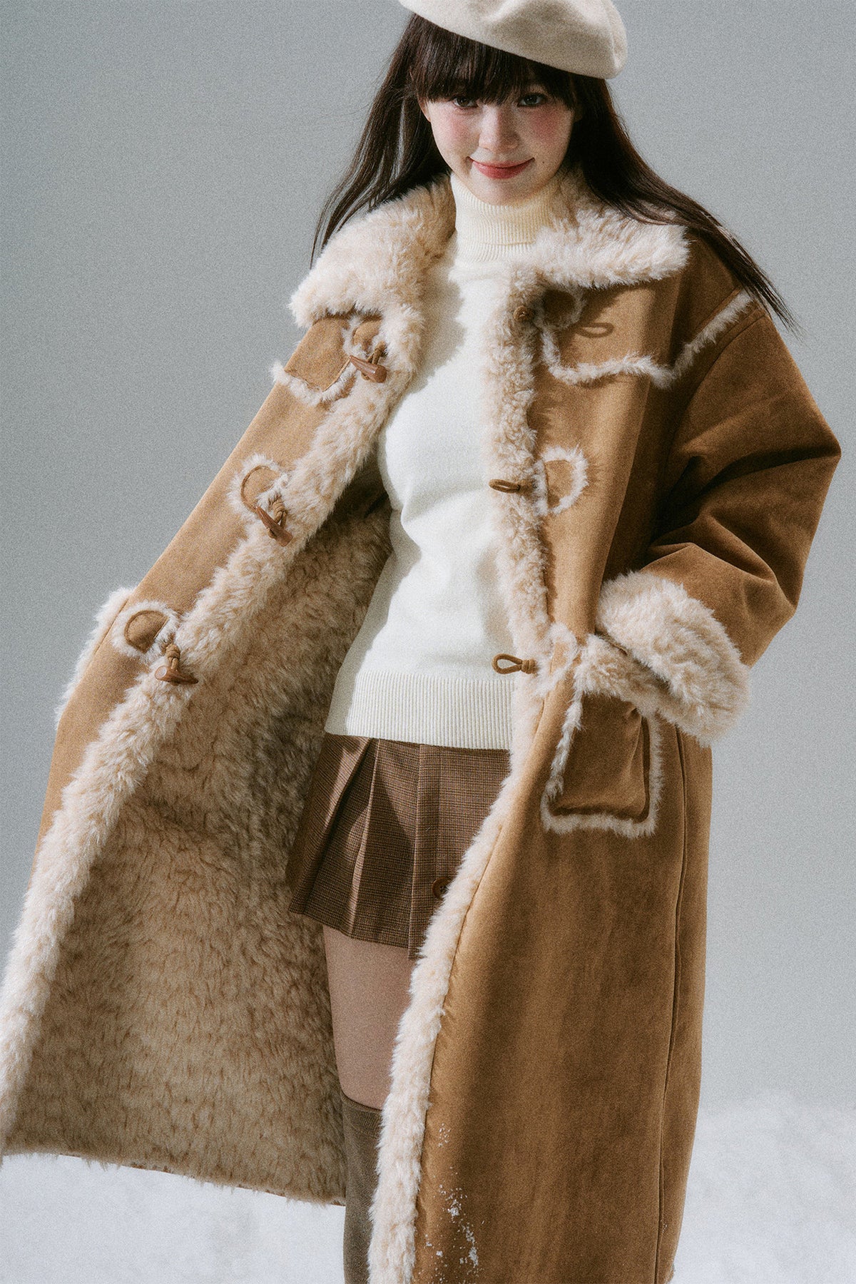 Manteau long à boutons en corne