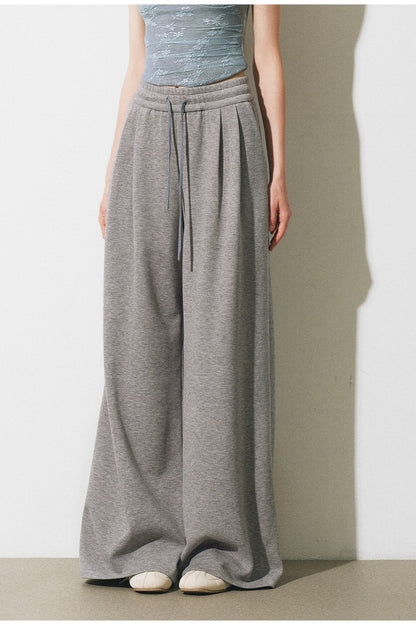 Completo giacca, gilet con bordi in pizzo e pantaloni ampi a maglia