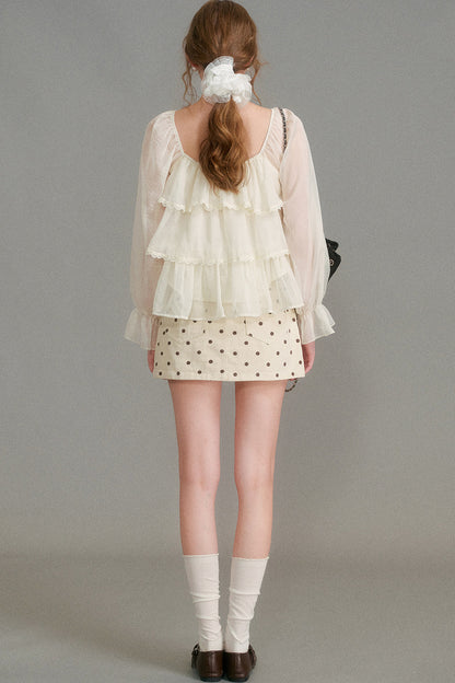 Blouse en mousseline à col carré et volants