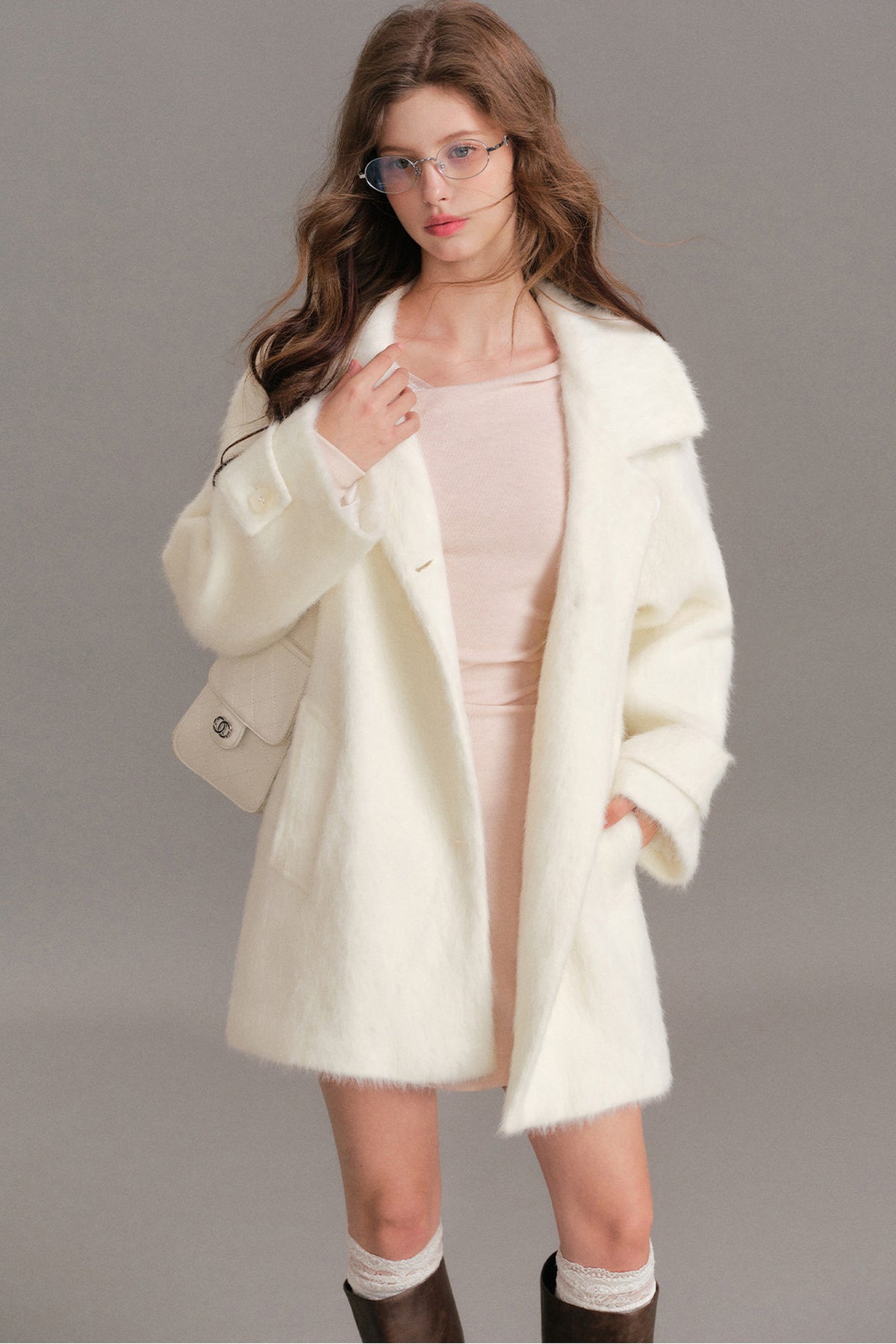 Manteau mi-long en laine imitation vison à épaules tombantes