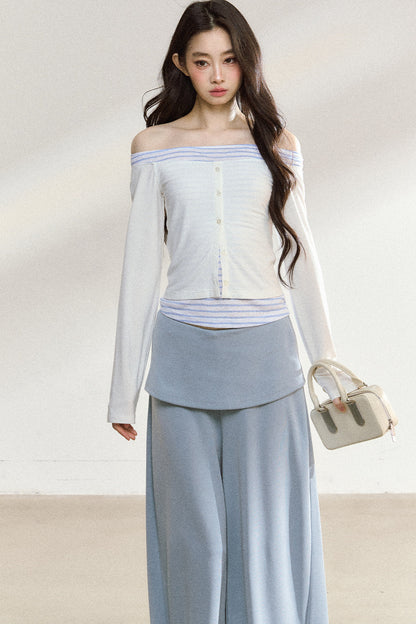 Completo con top a maniche lunghe con spalle scoperte e pantaloni ampi