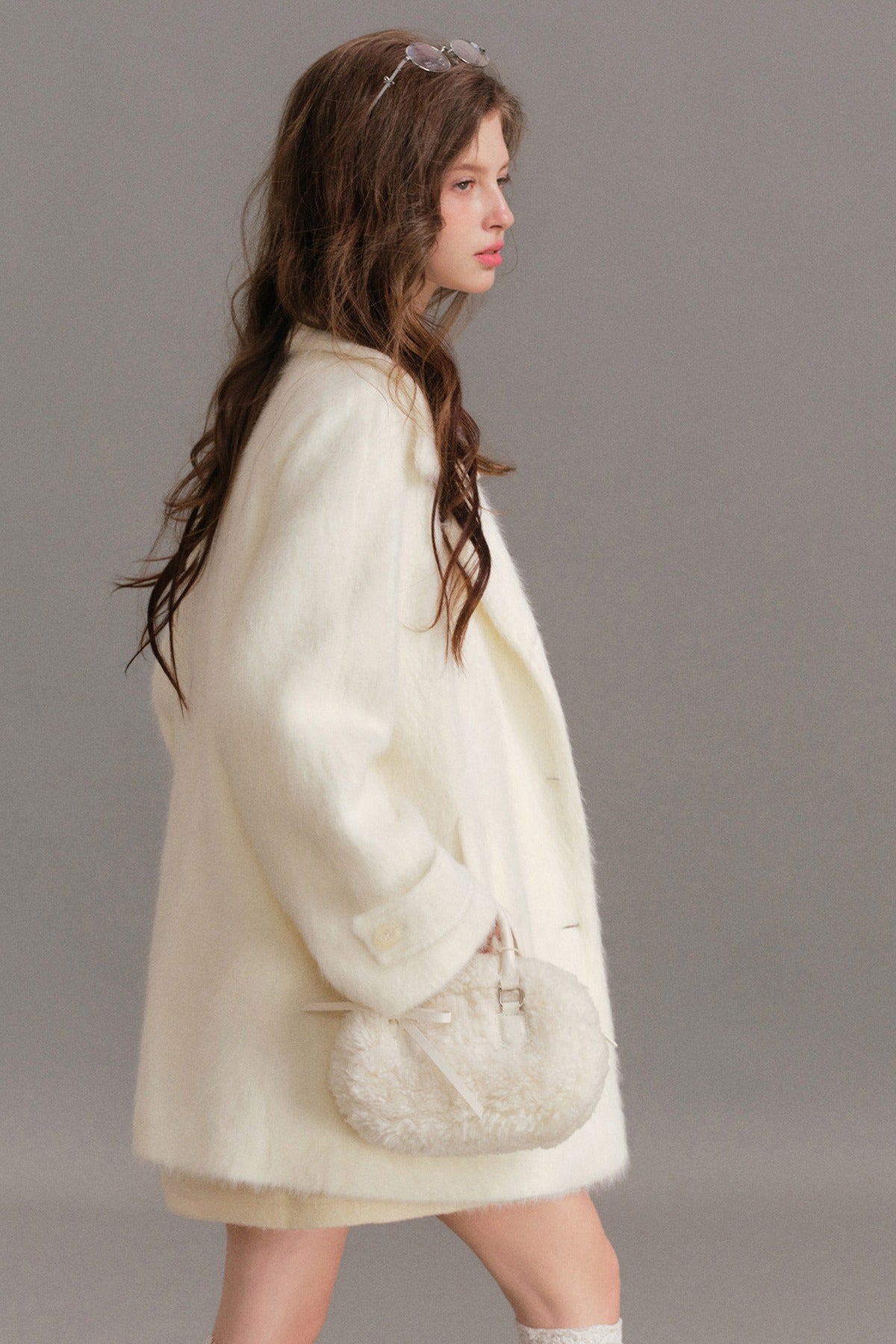 Manteau mi-long en laine imitation vison à épaules tombantes